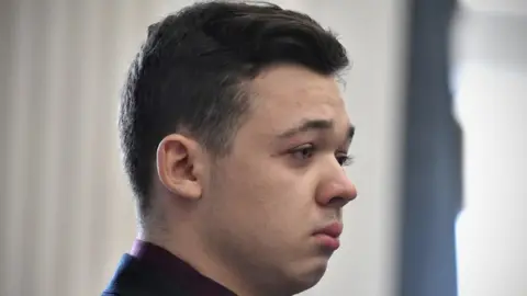 Kyle Rittenhouse reacts to the verdict during his trial at the Kenosha County Courthouse in Kenosha, Wisconsin, U.S., November 19, 2021.