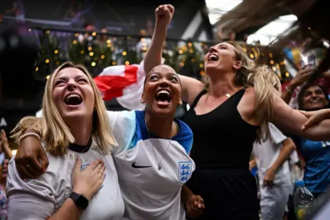 Justin Tallis / AFP England fans celebrate victory over Australia