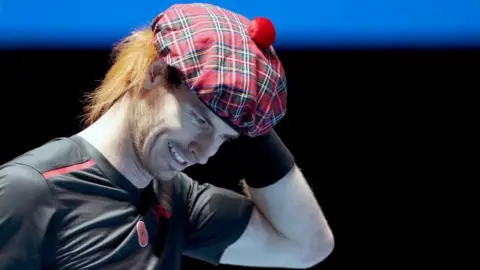 PA Andy Murray wearing tartan hat