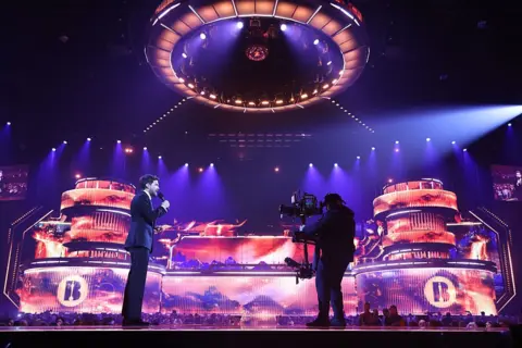 Getty Images Jack Whitehall hosts the Brits dressed in a black suit.