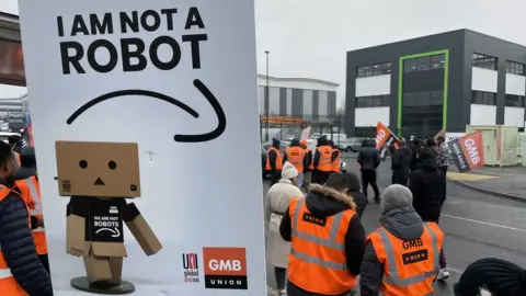 PA Media Workers outside Amazon centre