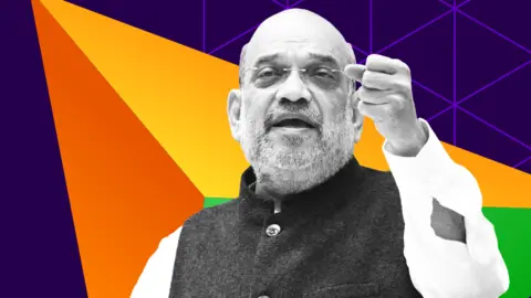 Amit Shah in black and white with one first raised while talking, ona background of purple, orange and green