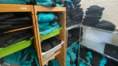 School uniform items stacked up