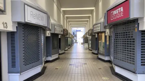 Shuttered shops in Coventry's City Arcade