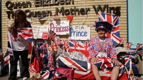 PA People wait outside St Mary's hospital