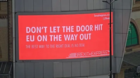 Brexit Express A billboard in Cardiff put up by pro-Leave group Brexit Express, reading: "Don't let the door hit EU on the way out".
