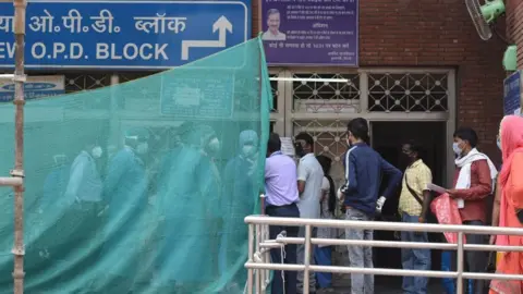 Getty Images A line outside a Delhi state hospital