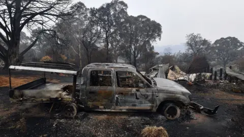 Getty Images A woodchip mill burnt by bushfires in Quaama in Australia's New South Wales