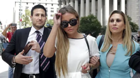 Getty Images Jennifer Araoz (C) with her lawyer after a court hearing