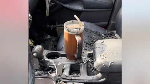 TikTok Stanley cup in a burnt-out car