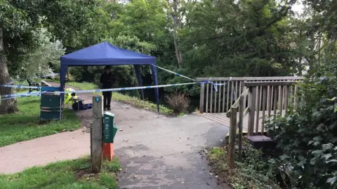 BBC The police cordon near where the bones were found