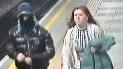 British Transport Police CCTV image of a man and a woman police would like to speak to in connection with the attack