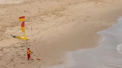 Getty Images A lone lifeguard on a beach in southern New South Wales