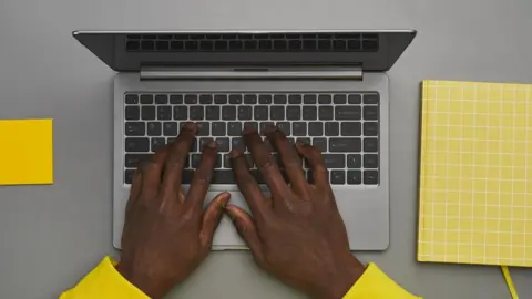 Getty Images Person with hands on a keyboard
