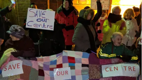 Protesters outside the council meeting