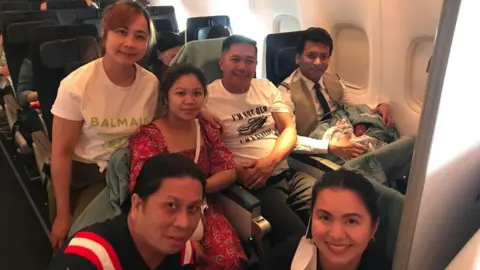 Sheryl Pascua Mrs Pascua (l) with the mother and the baby