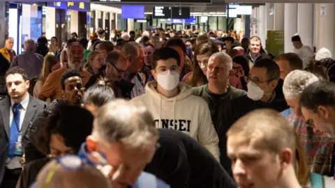 EPA  Passengers in delays at Frankfurt airport