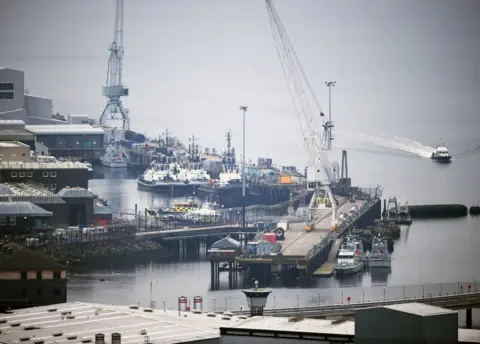 Getty Images A general view of Faslane submarine base on March 17, 2015 in Faslane, Scotland. The Trident weapons system is up for renewal in 2016 and is set to be a key issue during the general election campaign.