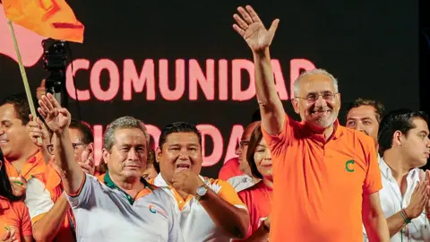 Reuters Carlos Mesa, opposition presidential candidate, waves to the crowd during a rally