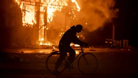 Getty Images Fire at a petrol station in Minneapolis