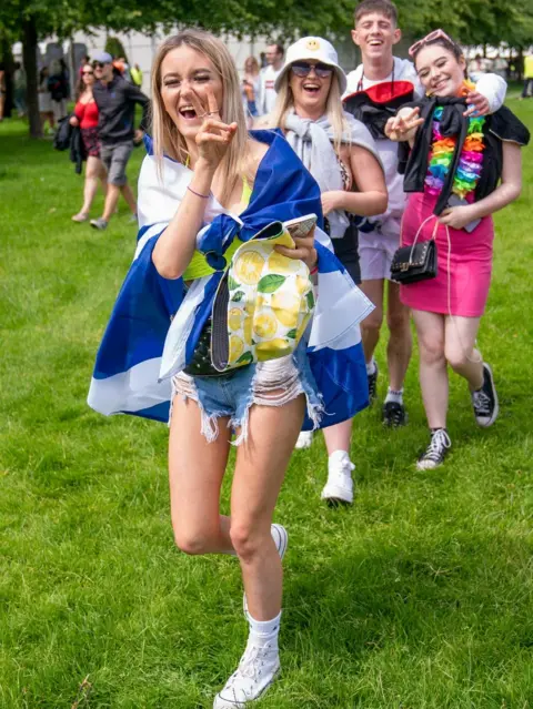 PA Media fans arrive at the festival