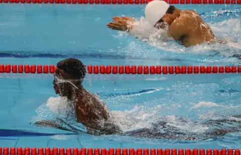 AFP Larry Feni Graig of Uganda (L) competes in the Special Olympics in Abu Dhabi on 18 March 2019.