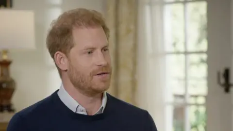 ITV A still of Prince Harry from the interview with ITV's Tom Bradby, the image showing his face and shoulders. He appears to be midway through speaking.