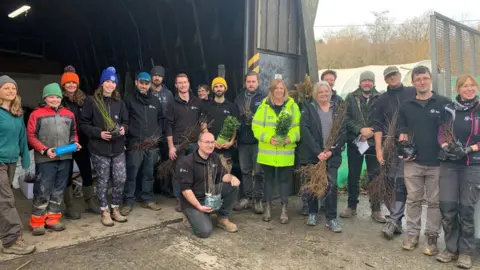 BBC Group of people who have been packing trees