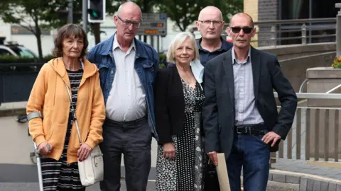 Liam McBurney Family members of Bloody Sunday victim James Wray (left to right) - Margaret, John, Doreen, family solicitor Greg McCartney and Liam Wray