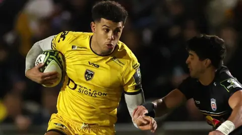 Rio Dyer dives to score a try for Dragons against Newcastle