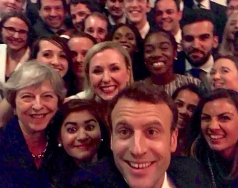 Emmanuel Macron Theresa May and Emmanuel Macron pose for selfie