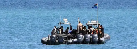 AFP A migrant boat seen off the coast of Libya