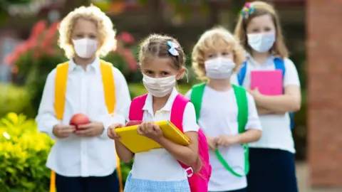 Getty Images School children in face masks