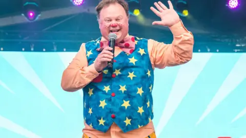 Hello Content for Camp Bestival Shropshire Mr Tumble waving