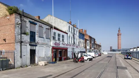 Historic England View of shops in Grimsby Docks