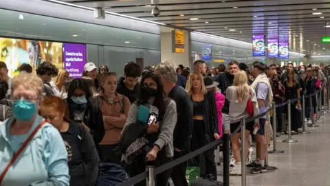 Getty Images Long queues at Heathrow during the pandemic