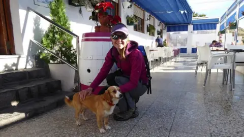 Dan Colegate Esther in cafe stroking Leela on first meeting