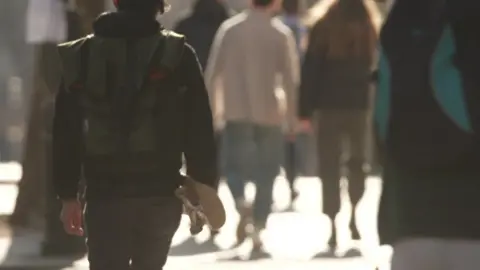 BBC File photo of anonymous students walking near a campus in London