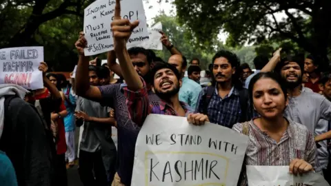 Reuters Opponents of the move protest in Delhi