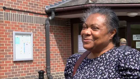 Woman outside polling station