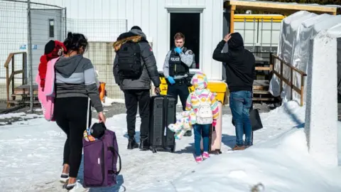 Getty Images Migrants cross at Roxham Road