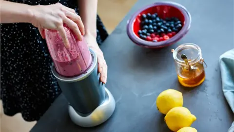 Getty Images Making a smoothie