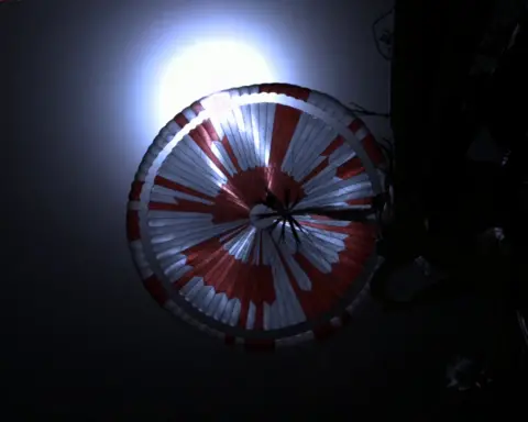 Nasa/JPL-Caltech Parachute shot from the spacecraft's backshell during descent