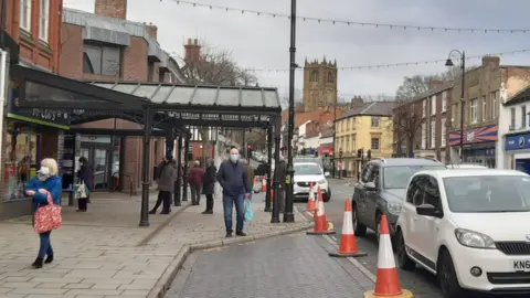 Shoppers on Mold High Street