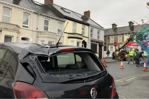 Car damaged by fallen scaffolding