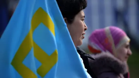 Getty Images File pic: A Crimean Tatar protests against Russia's move to annex Crimea in Simferopol in 2014