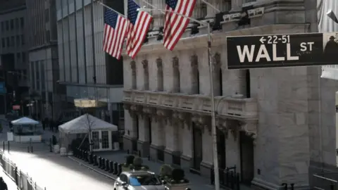 Getty Images New York Stock exchange with Wall Street street sign in foreground.