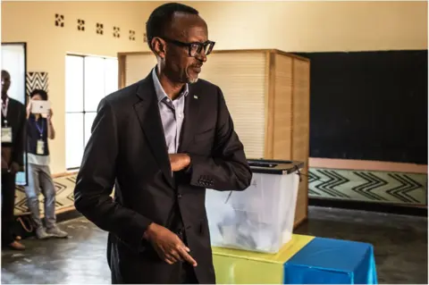 AFP Rwandan President Paul Kagame arrives to cast his vote at a polling station in Kigali, 4 August
