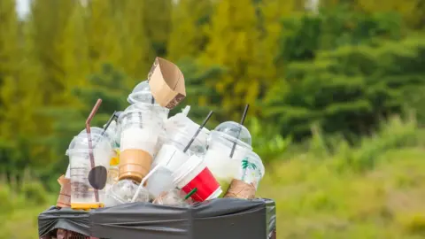 Getty Images A bin full of litter