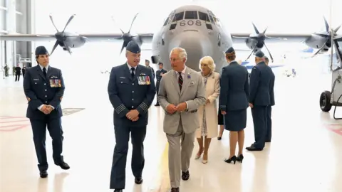 Getty Images Prince Charles and Camilla at the Trenton military base